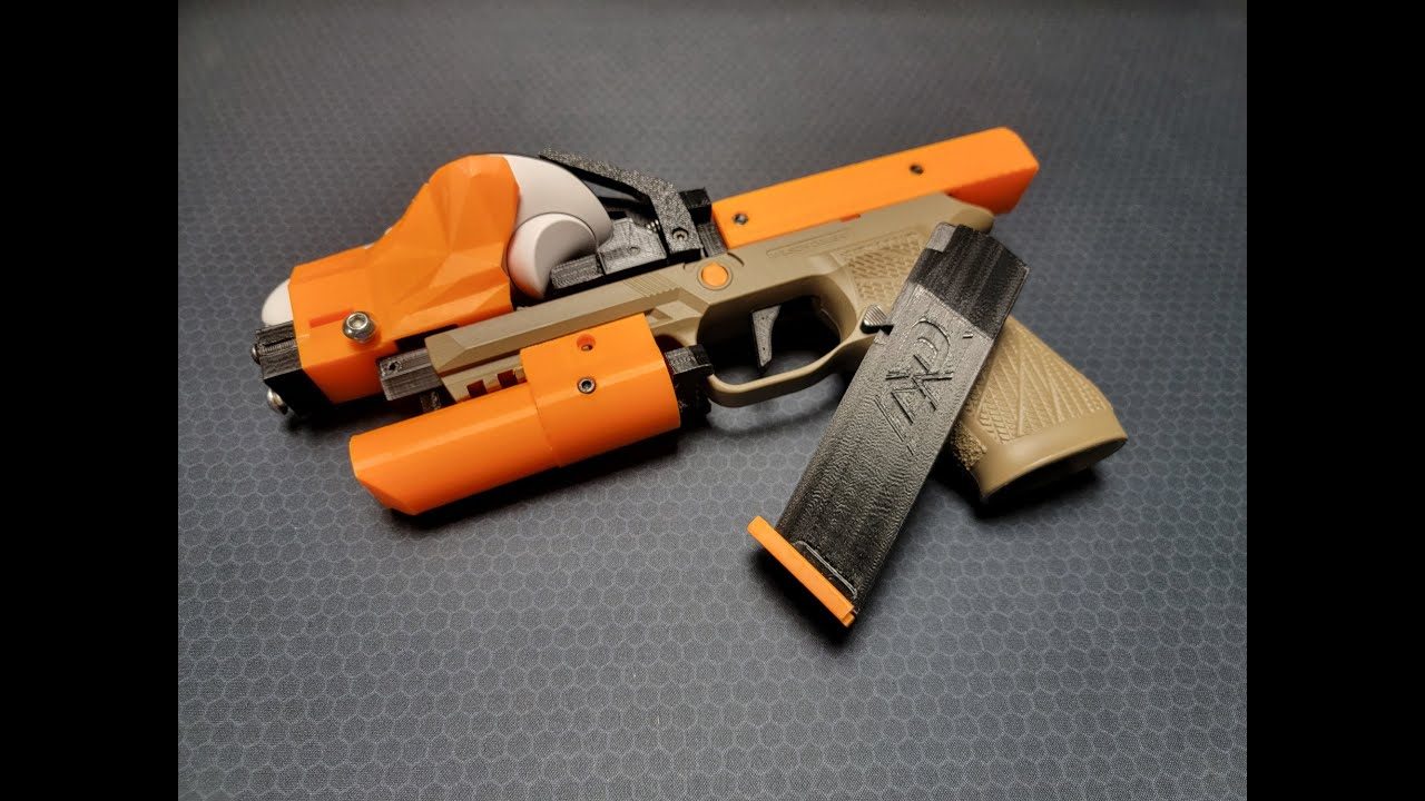 XR Pistol adapter with a Quest controller mounted and a weighted magazine beside it